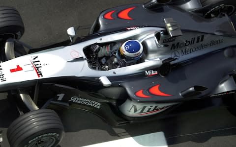 Finnish formula one champion Mika Hakkinen steers his McLaren Mercedes to the pits during the first free practices for the upcomming French formula one Grand Prix in Magny-Cours, central France, Friday June 30, 2000.  - Credit: AP