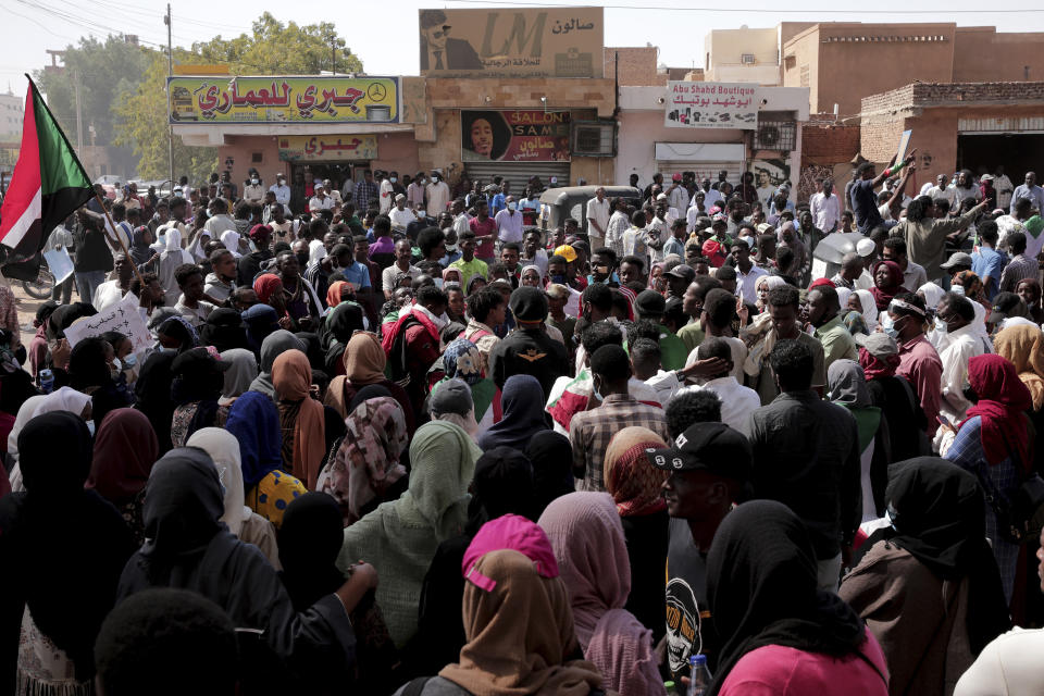 People chant slogans during a protest to denounce the October 2021 military coup, in Khartoum, Sudan, Thursday, Jan. 6, 2022. Sudanese took to the streets in the capital, Khartoum, and other cities on Thursday in anti-coup protests as the country plunged further into turmoil following the resignation of the prime minister earlier this week. (AP Photo/Marwan Ali)