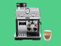 De'Longhi espresso machine on green background