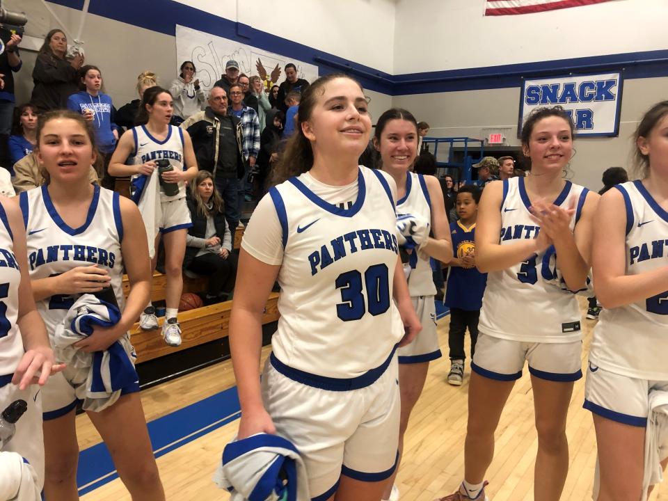 University Prep sophomore guard JoAnna Warren (center) is celebrated by teammates after reaching the 1,000 career points milestone against West Valley on Friday, Feb. 3, 2023.