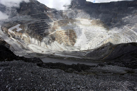 FILE PHOTO: Trucks operate in the open-pit mine of PT Freeport's Grasberg copper and gold mine complex near Timika, in the eastern region of Papua, Indonesia on September 19, 2015 in this photo taken by Antara Foto. REUTERS/Muhammad Adimaja/Antara Foto/File Photo