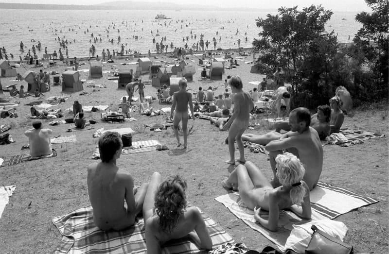 Dozens of nudists sunbathe at Müggelsee lake in East Berlin in May 1986. A new exhibition in Hanover traces the history of Germany's Freikörperkultur (FKK) movement - which roughly translates as free body culture, or naturism. Thomas Uhlemann/dpa