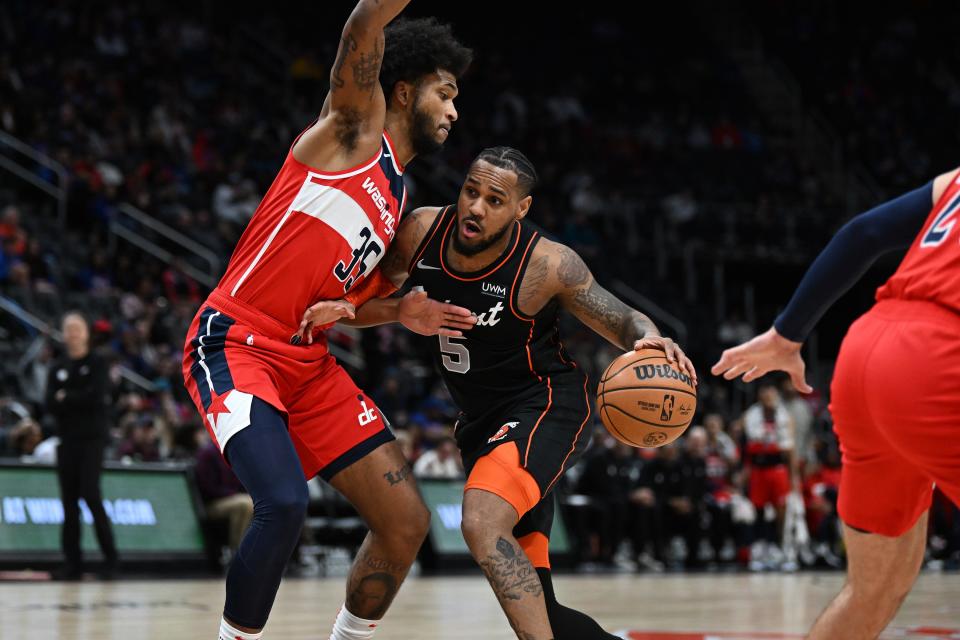 Detroit Pistons guard Monte Morris drives to the basket against Washington Wizards center Marvin Bagley III in the first quarter at Little Caesars Arena, Jan. 27, 2024.