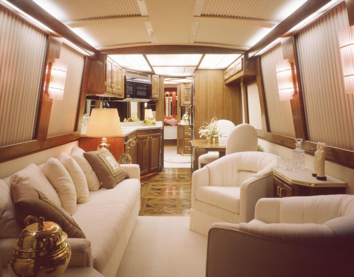 This image is a 40' luxury bus motor home interior view looking from the front to rear.