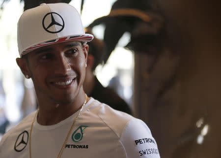 Mercedes Formula One driver Lewis Hamilton of Britain arrives at a news conference at the Yas Marina circuit before the start of the Abu Dhabi Grand Prix November 20, 2014. REUTERS/Ahmed Jadallah