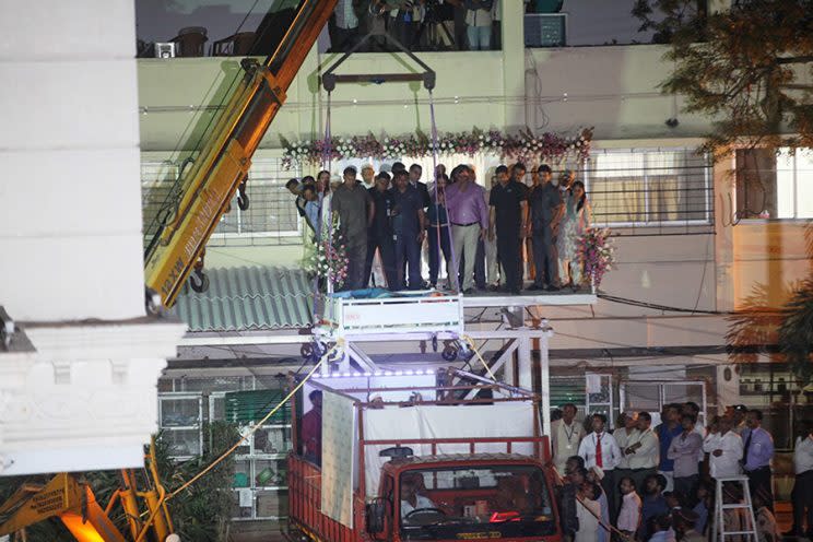 A crane lowers Abd El Aty in Mumbai via cargo plane. (Photo: Caters News)