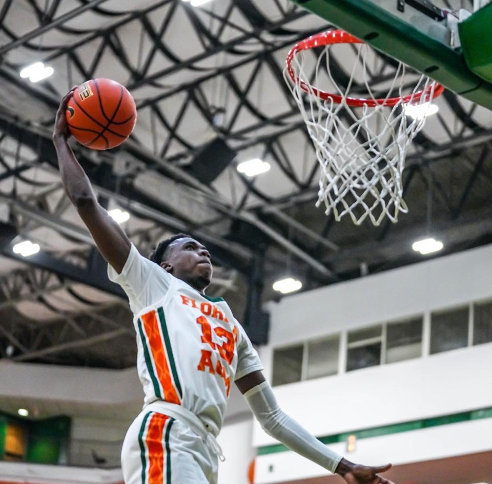 Jamir Williams soars for a slam dunk for Florida A&M in the 76-63 win over Fort Valley State on Wednesday, Dec. 1, 2021.