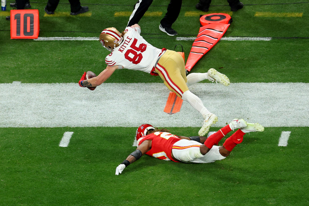 George Kittle stretched for a critical fourth-down conversion in Sunday's Super Bowl. (Michael Reaves/Getty Images)