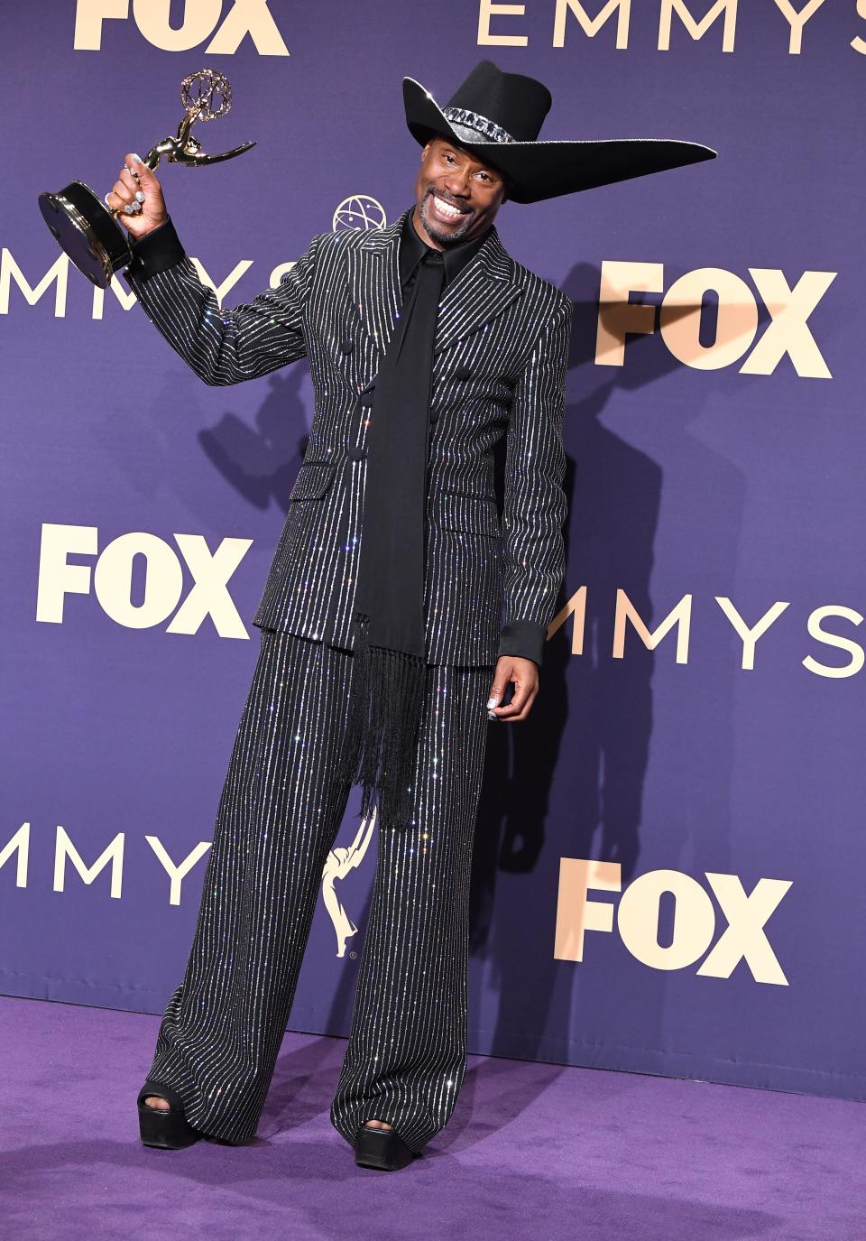 Billy Porter at the 2019 Emmys in oversized black suit and large hat