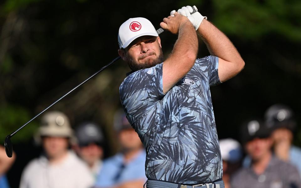 Tyrrell Hatton of England plays his shot from the third tee during the second round