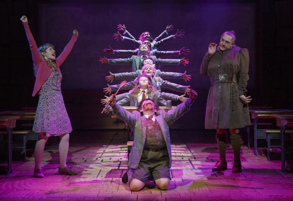 This theater publicity image released by Boneau/Bryan-Brown shows the cast of "Matilda The Musical," including Bertie Carvel, right, and Lauren Ward, left, during a performance in New York. (AP Photo/Boneau/Bryan-Brown, Joan Marcus)