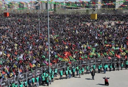 Demonstrators gather to celebrate the spring festival of Newroz in the Kurdish-dominated southeastern city of Diyarbakir, Turkey March 21, 2016. REUTERS/Sertac Kayar