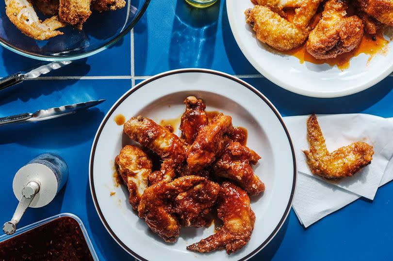 Fried chicken on plates and bowls from the air fryer