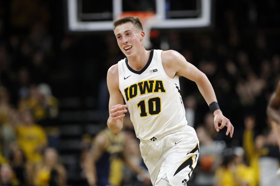 Iowa guard Joe Wieskamp smiles after making a 3-point basket during the first half of the team's NCAA college basketball game against Michigan, Friday, Feb. 1, 2019, in Iowa City, Iowa. (AP Photo/Charlie Neibergall)