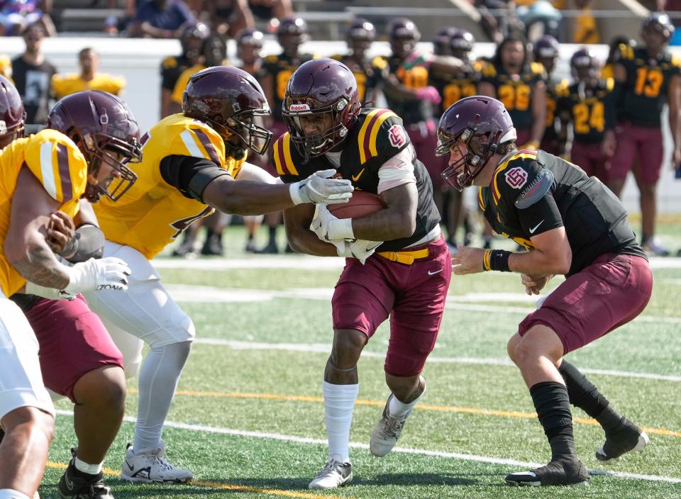 Bethune-Cookman's Terry Lindsey (7) charges toward the goal line during the Wildcats' spring football game at Daytona Stadium, Saturday, April 20, 2024.