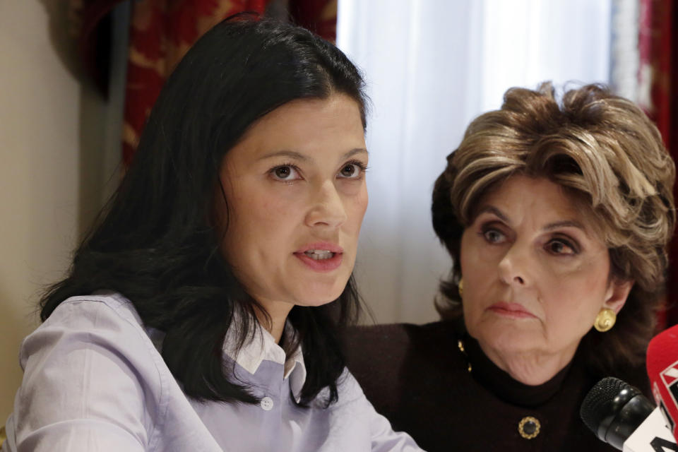 FILE - Actress Natassia Malthe, left, accompanied by attorney Gloria Allred, reads a statement during a news conference in New York, on Oct. 25, 2017, where she alleged sexual assault by Harvey Weinstein in 2010. Malthe, a Norwegian model said Weinstein appeared uninvited at her London hotel room door and raped her after the 2008 British Academy Film Awards. (AP Photo/Richard Drew, File)