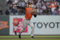 Baltimore Orioles third baseman Gunnar Henderson throws out San Francisco Giants' Mitch Haniger at first base during the second inning of a baseball game in San Francisco, Saturday, June 3, 2023. (AP Photo/Jeff Chiu)