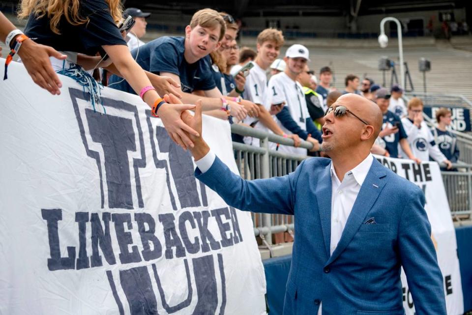 Penn State football coach James Franklin greets fans after arriving at Beaver Stadium for the game against Delaware on Saturday, Sept. 9, 2023.