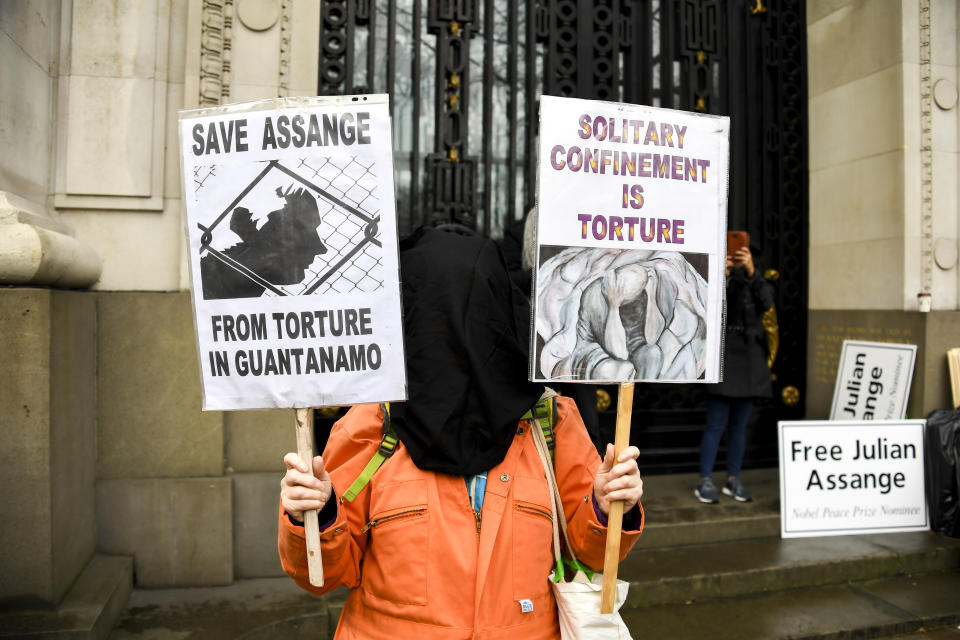 Demonstrators gather outside Australia House to protest against the extradition of Wikileaks founder Julian Assange, in London, Saturday, Feb. 22, 2020. Assange is fighting extradition to the United States on spying charges. (AP Photo/Alberto Pezzali)