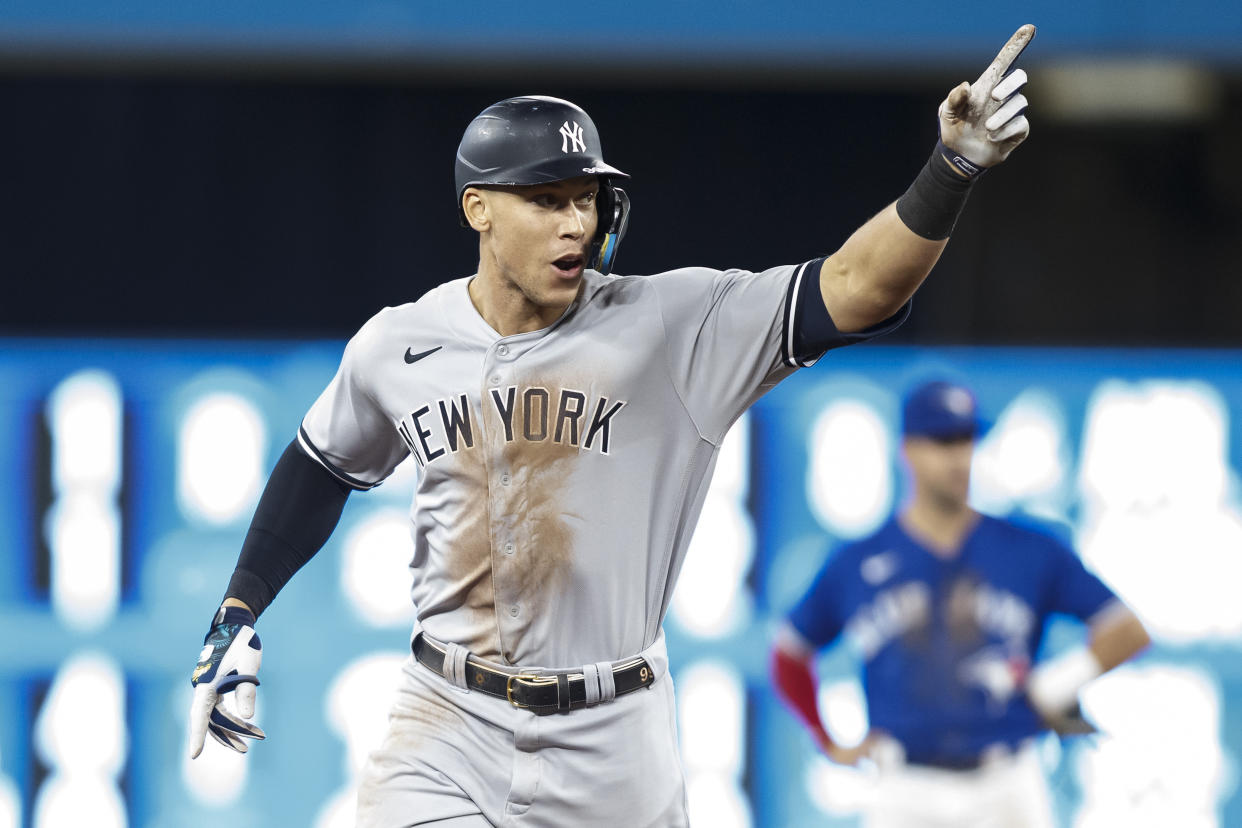 TORONTO, ON - SEPTEMBER 28:  Aaron Judge #99 of the New York Yankees runs the bases as he hits his 61st home run of the season in the seventh inning against the Toronto Blue Jays at Rogers Centre on September 28, 2022 in Toronto, Ontario, Canada. Judge has now tied Roger Maris for the American League record.  (Photo by Cole Burston/Getty Images)