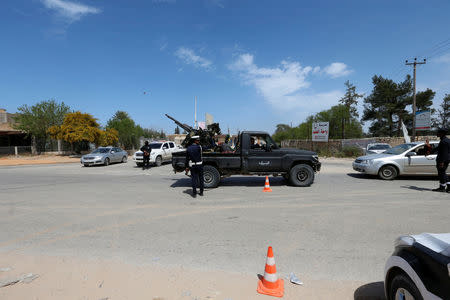 A military vehicle belonging to the Libyan internationally recognized pro-government forces stands at a checkpoint in Ain Zara, south of Tripoli, Libya April 11, 2019. REUTERS/Ismail Zitouny