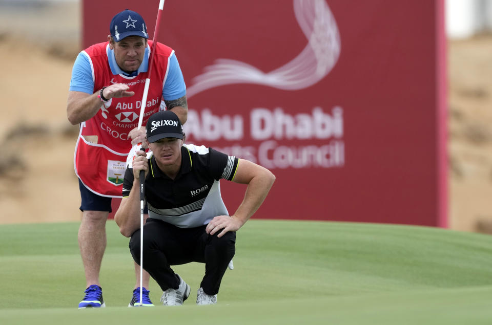 Sean Crocker from the U.S. studies a shot on the 10th hole during the first round of the Abu Dhabi Championship golf tournament at the Yas Links Golf Course, in Abu Dhabi, United Arab Emirates, Thursday, Jan. 20, 2022. (AP Photo/Kamran Jebreili)