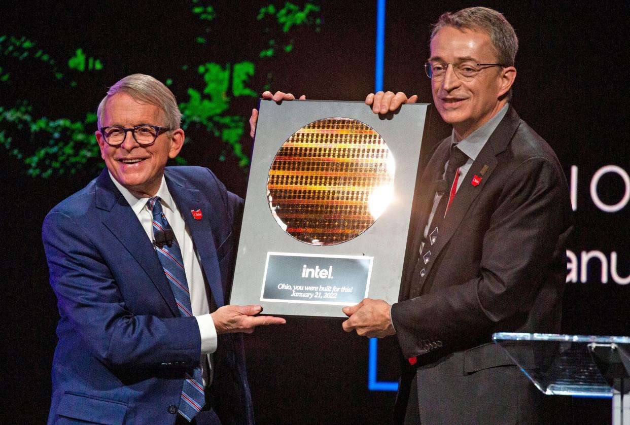 Ohio Gov. Mike DeWine receives a plaque from Intel President and CEO Pat Gelsinger during a Jan. 21 announcement that Intel will be investing $20 billion to build two computer chip factories in Jersey Township, in Licking County.