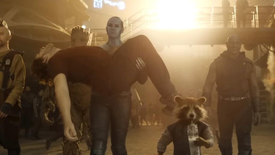 Nebula carries a lifeless Peter Quill as she walks with the other Guardians in Guardians of the Galaxy Vol. 3