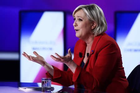 Marine Le Pen, French National Front (FN) political party leader and candidate for French 2017 presidential election, attends the France 2 television special prime time political show, "15min to Convince" in Saint-Cloud, near Paris, France, April 20, 2017. REUTERS/Martin Bureau/Pool