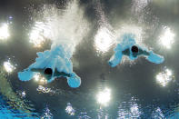 LONDON, ENGLAND - JULY 30: (L-R) Yuan Cao and Yanquan Zhang of China compete in the Men's Synchronised 10m Platform Diving on Day 3 of the London 2012 Olympic Games at the Aquatics Centre on July 30, 2012 in London, England. (Photo by Adam Pretty/Getty Images)