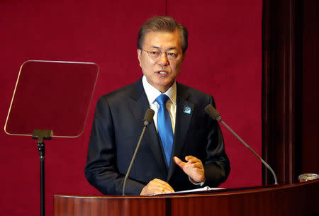 South Korean President Moon Jae-in delivers his speech on the 2018 budget bill during a plenary session at the National Assembly in Seoul, South Korea, November 1, 2017. Yonhap via REUTERS