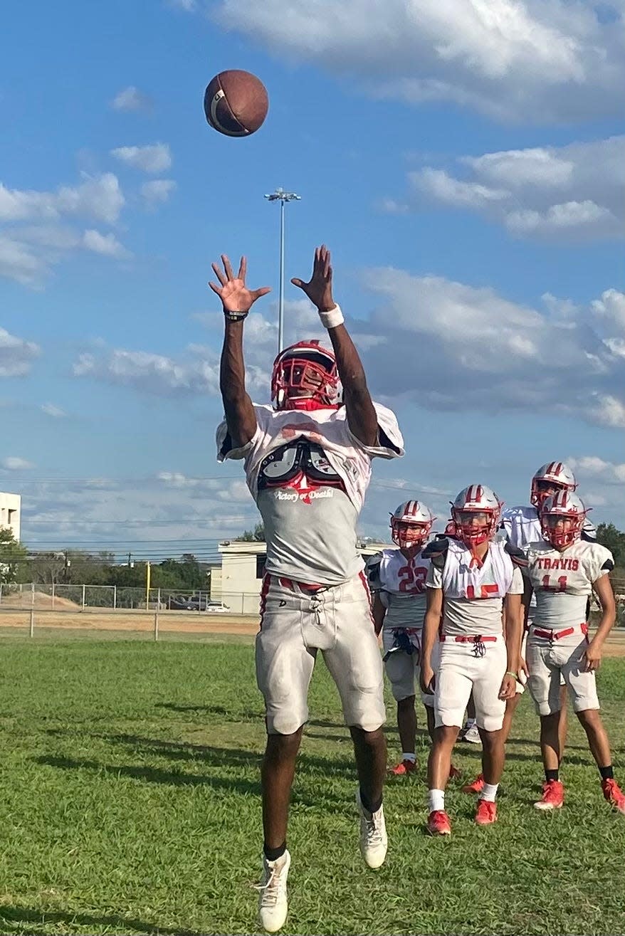 Under the watchful eye of head coach Joe Martinez, Travis players go through drills during the season last October. The Rebels went 6-5 and made the playoffs in 2023, and players hope to continue that rise in 2024.