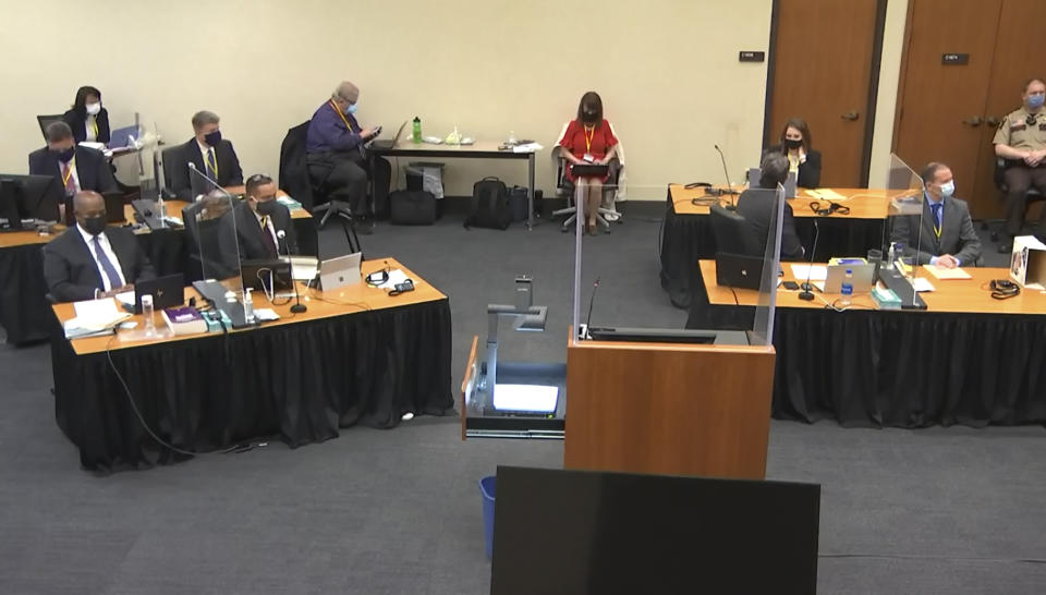 In this image from video, the court listens as Hennepin County Judge Peter Cahill presides over pre-trial motions prior to opening statements, Monday, March 29, 2021, in the trial of former Minneapolis police officer Derek Chauvin, in the May 25, 2020, death of George Floyd at the Hennepin County Courthouse in Minneapolis, Minn. (Court TV via AP, Pool)