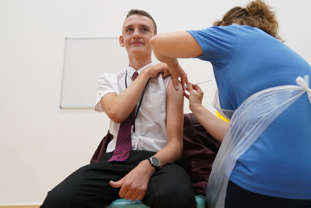 Jack Lane, 14, receives a Covid-19 vaccination at Belfairs Academy in Leigh-on-Sea, Essex (Gareth Fuller/PA) (PA Wire)