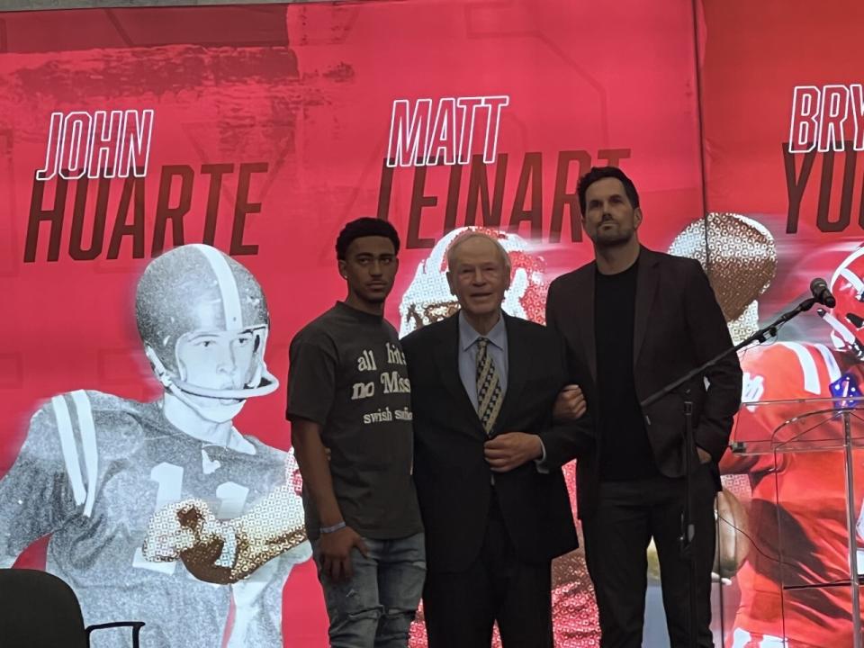 Bryce Young, from left, John Huarte and Matt Leinart pose for a photo at Mater Dei High.