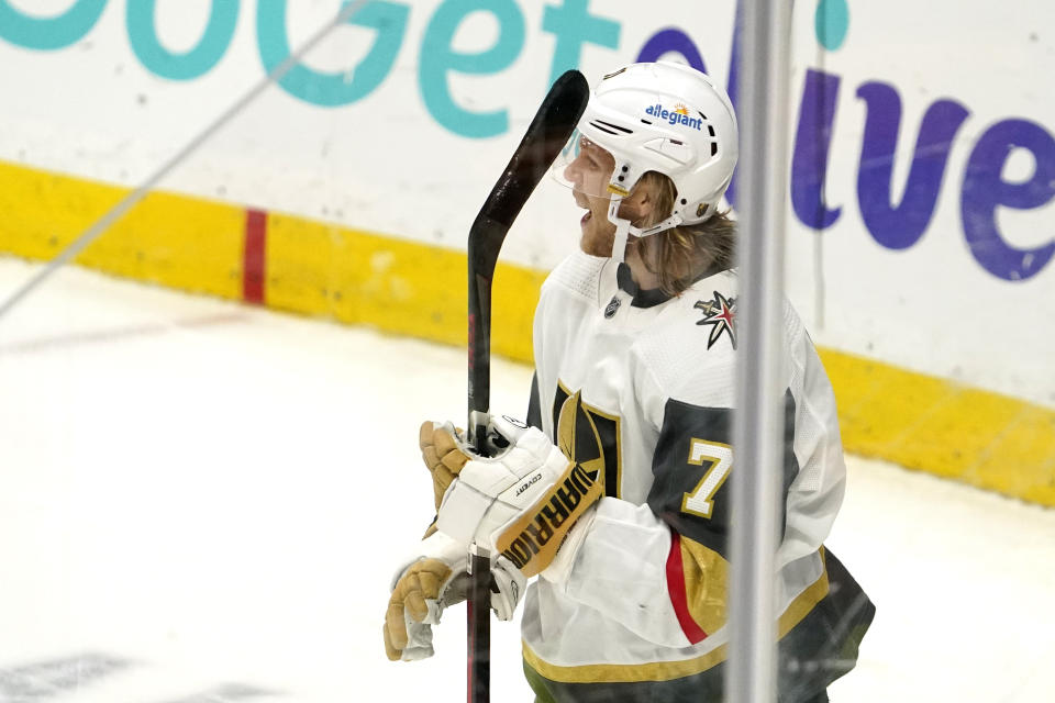 Vegas Golden Knights center William Karlsson, right, celebrates his game-winning goal during overtime in an NHL hockey game against the Anaheim Ducks Saturday, Feb. 27, 2021, in Anaheim, Calif. The Golden Knights won 3-2 in overtime. (AP Photo/Mark J. Terrill)