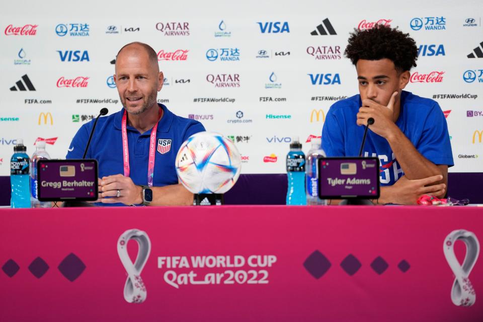 Head coach Gregg Berhalter, left, and Tyler Adams, both of the United States attend a press conference on the eve of the round of 16 World Cup soccer match between the Netherlands and the United States at Kalifa International Stadium, in Doha, Qatar, Friday, Dec. 2, 2022. (AP Photo/Ashley Landis)