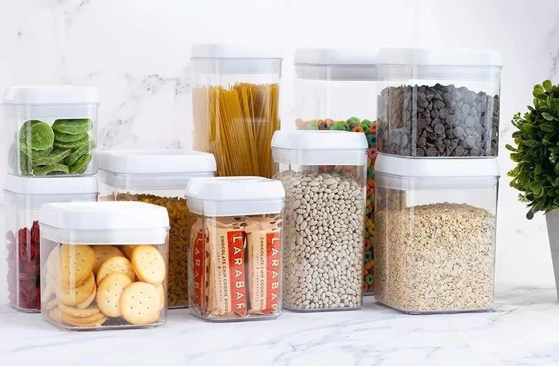 small and large clear food containers with crackers, snack bars, and pasta