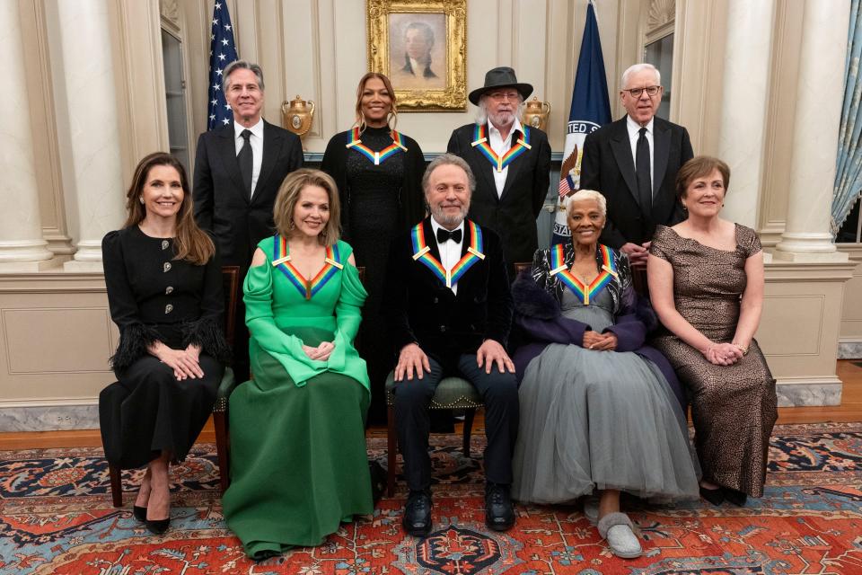 From left, Evan Ryan, Secretary of State Antony Blinken, 2023 Kennedy Center Honorees Renée Fleming, Queen Latifah, Billy Crystal, Barry Gibb, Dionne Warwick, Kennedy Center Chairman David Rubenstein, and Kennedy Center President Deborah Rutter pose for a photo at the State Department following the Kennedy Center Honors gala dinner, Saturday, Dec. 2, 2023, in Washington. (AP Photo/Kevin Wolf) ORG XMIT: DCKW128