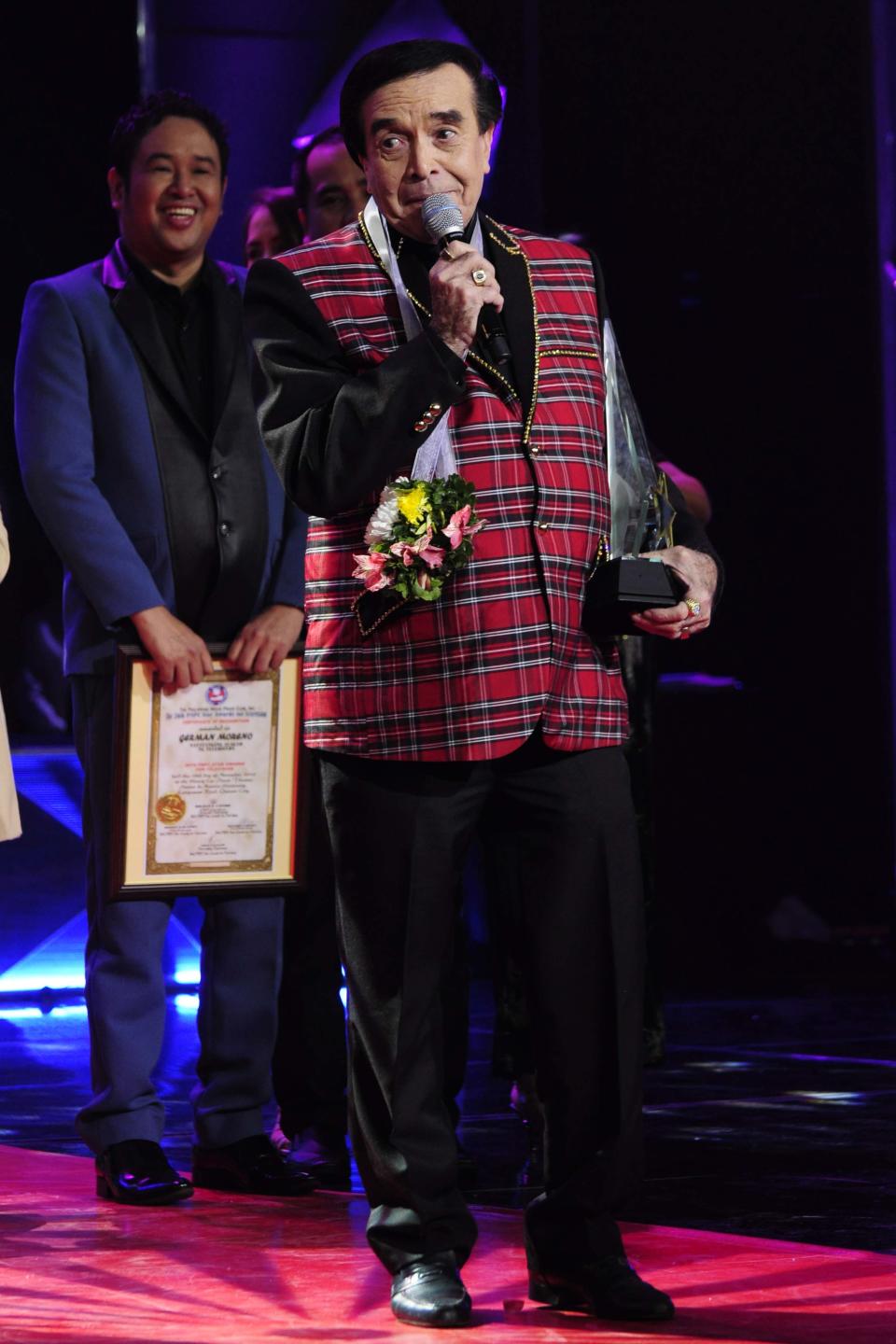 German Romero receives his "Natatanging Alagad ng Telebisyon" special award during the 26th Star Awards for TV held at the Henry Lee Irwin Theater in Ateneo De Manila University on 18 November 2012. (Angela Galia/NPPA images)