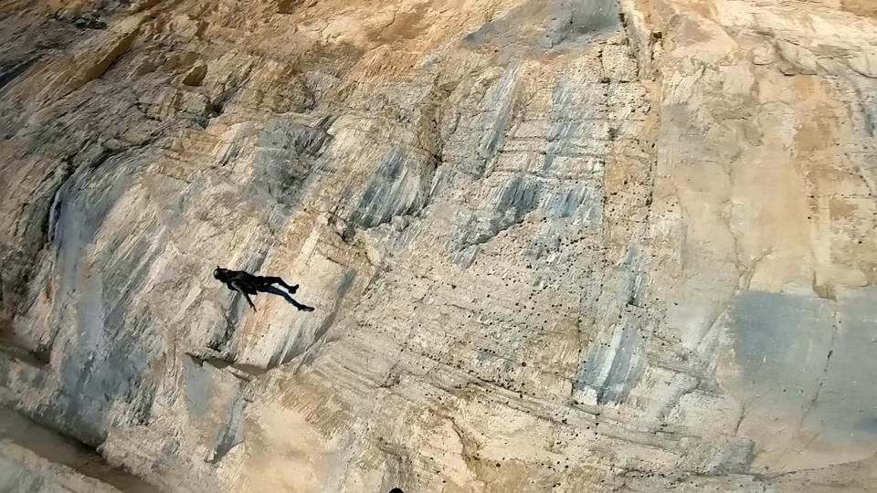 These friends filmed themselves freefalling backwards from a cliff - while holding hands. Josephine Eve, 28, and Niclas Strohmeier, 23, performed the stunt at the BASE jumping hotspot of Monte Brento, Italy. They fall backwards into the dense mist below before separating in the air and landing safely.