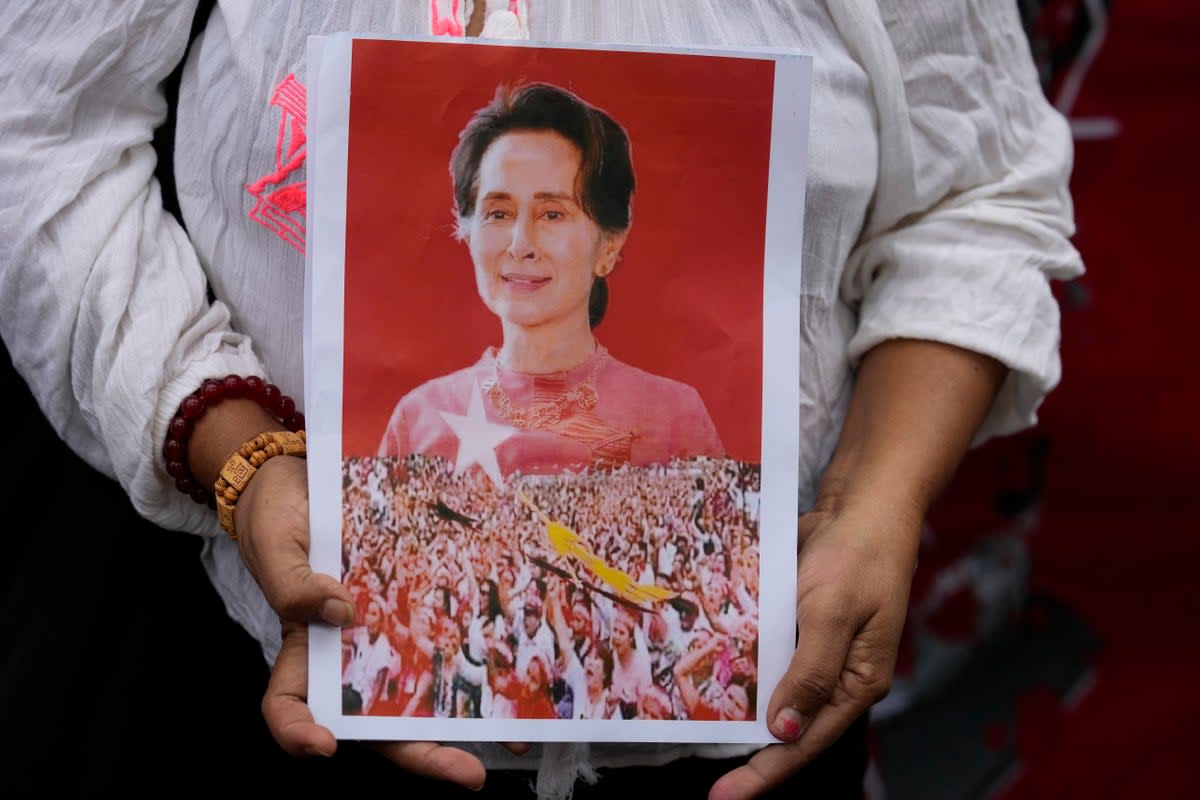 A supporter shows a portrait of former leader Aung San Suu Kyi (Copyright 2023 The Associated Press. All rights reserved.)