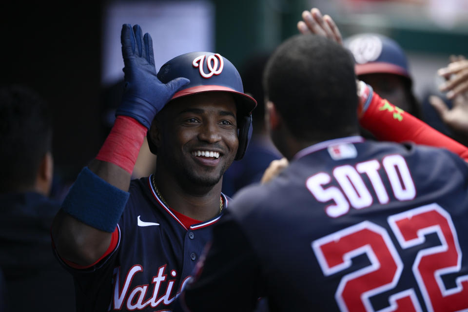 Washington Nationals' Victor Robles, left, celebrates his three-run home run with Juan Soto (22) during the fourth inning of the first baseball game of a doubleheader against the Colorado Rockies, Saturday, May 28, 2022, in Washington. (AP Photo/Nick Wass)