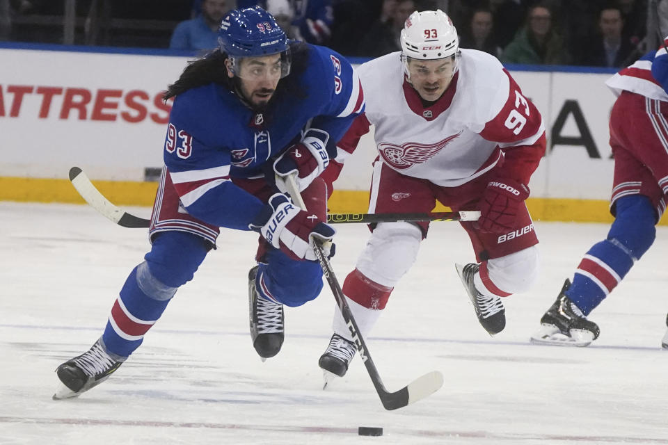 New York Rangers' Mika Zibanejad, left, breaks away from Detroit Red Wings' Alex DeBrincat during the second period of an NHL hockey game, Wednesday, Nov. 29, 2023, in New York. (AP Photo/Bebeto Matthews)