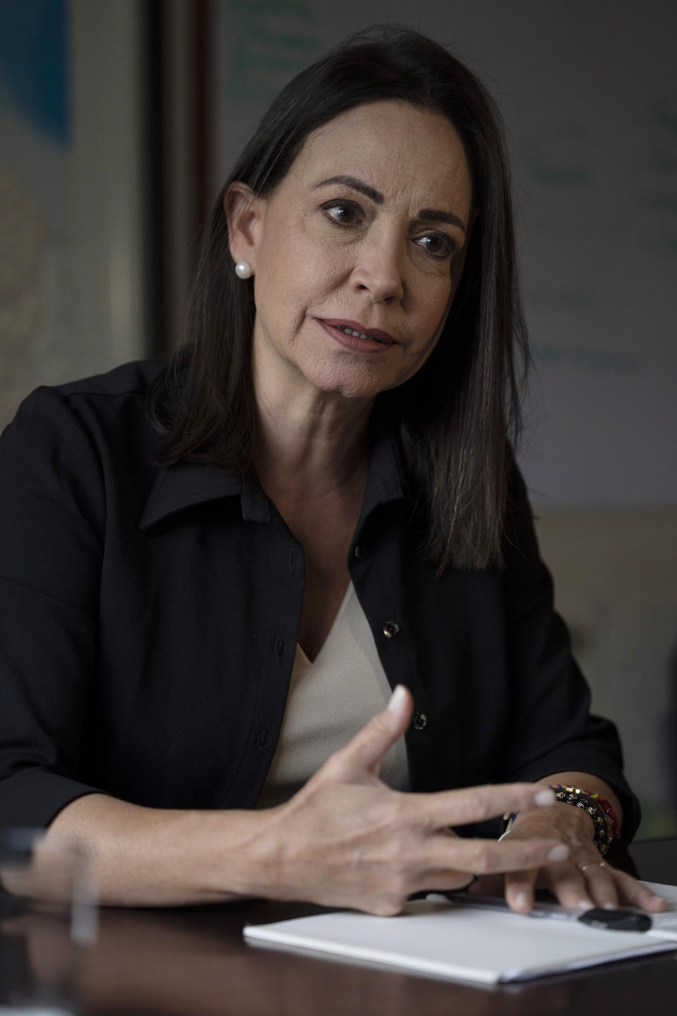 Opposition leader Maria Corina Machado gives an interview in her office at the headquarters of her political party Vente Venezuela in Caracas, Venezuela, Monday, June 26, 2023. The government’s move to ban her from public office has helped rally the fractured opposition and focus much-needed attention on their effort to hold an independent presidential primary election. (AP Photo/Ariana Cubillos)