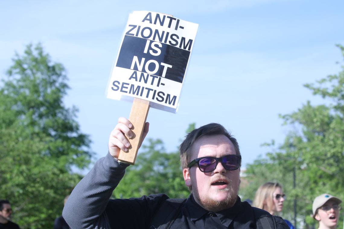 Peaceful protester holds an “Anti-Zionisim Is NOT Anti-Semitism” sign during the peaceful Free Palestine rally at the William T Young Library lawn on UK’s campus on May 1, 2024, in Lexington, Ky.