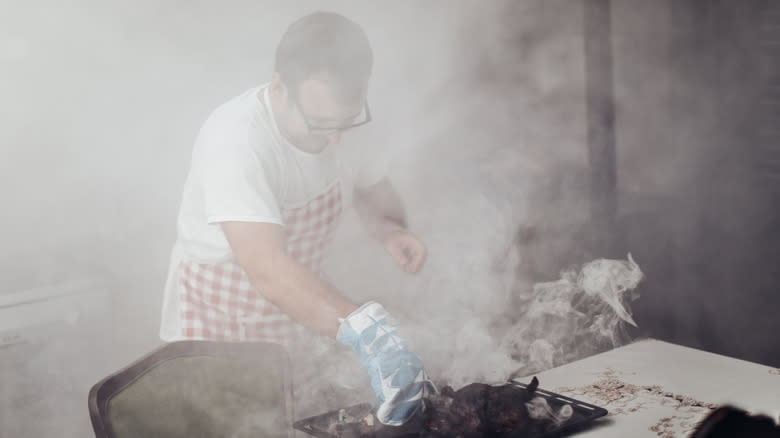 man with smokey burnt food