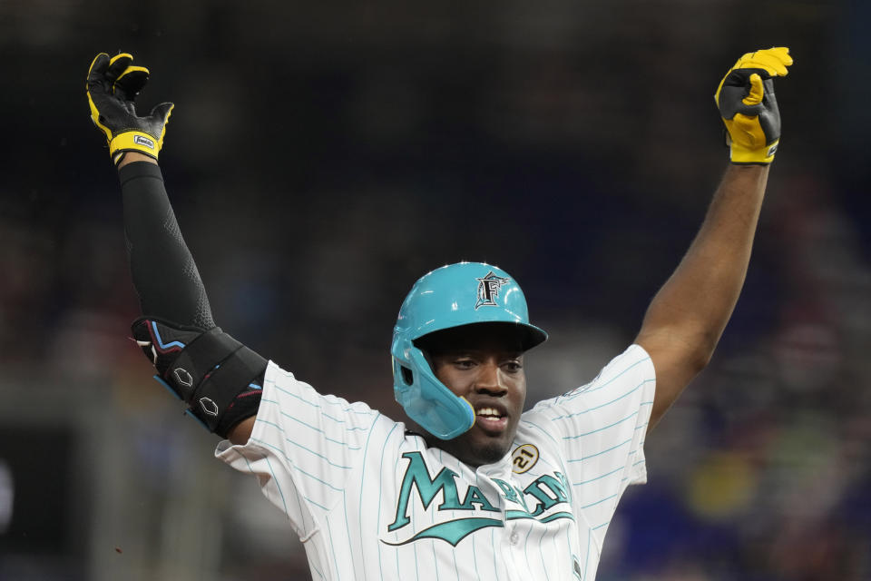 Miami Marlins' Jesus Sanchez slides safely into third base with a triple during the first inning of a baseball game against the Atlanta Braves, Friday, Sept. 15, 2023, in Miami. (AP Photo/Lynne Sladky)