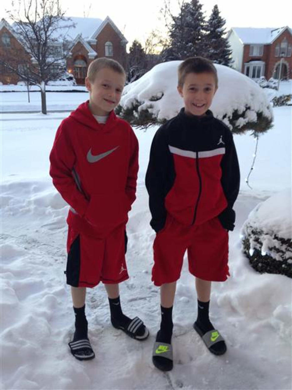 Eight-year-old twins Cameron, left, and Colin Corcoran show off their winter look in snowy Buffalo. (Courtesy Susan Corcoran)