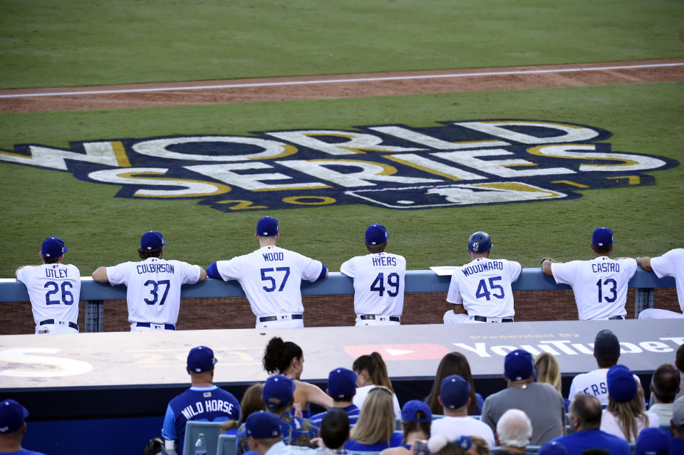 <p>Members of the Los Angeles Dodgers look on from the dugout during Game 1 of the 2017 World Series against the Houston Astros at Dodger Stadium on Tuesday, October 24, 2017 in Los Angeles, California. (Photo by LG Patterson/MLB Photos via Getty Images) </p>